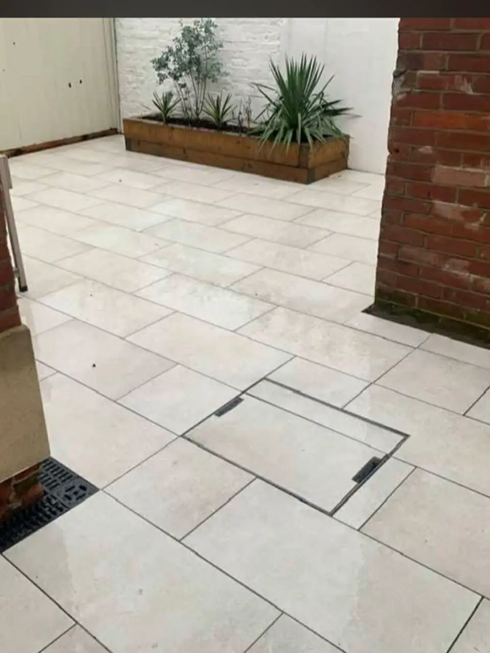 Bright porcelain patio with outdoor seating.