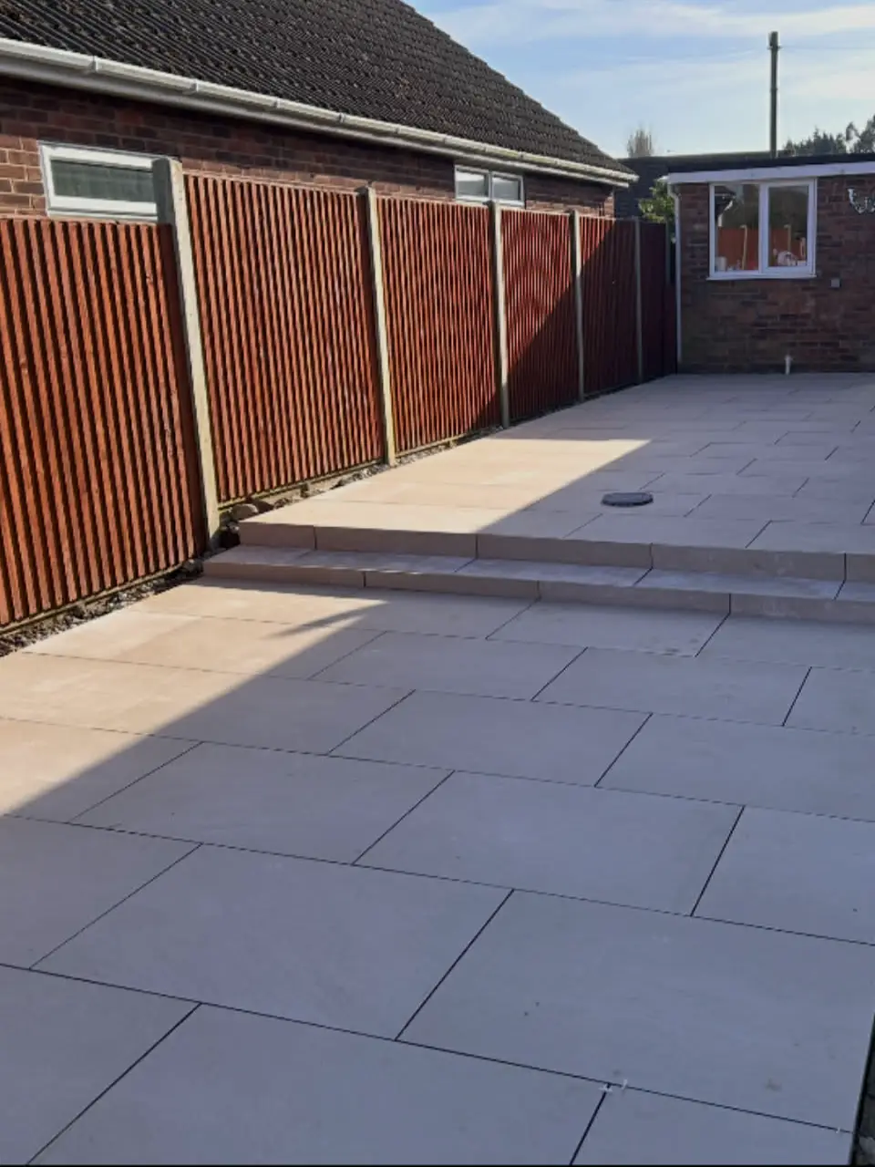 Family patio space with dining table and plants.
