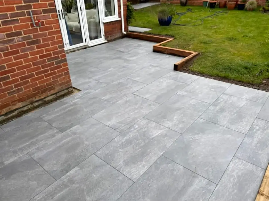 Patio extended to create dining and lounge zones.