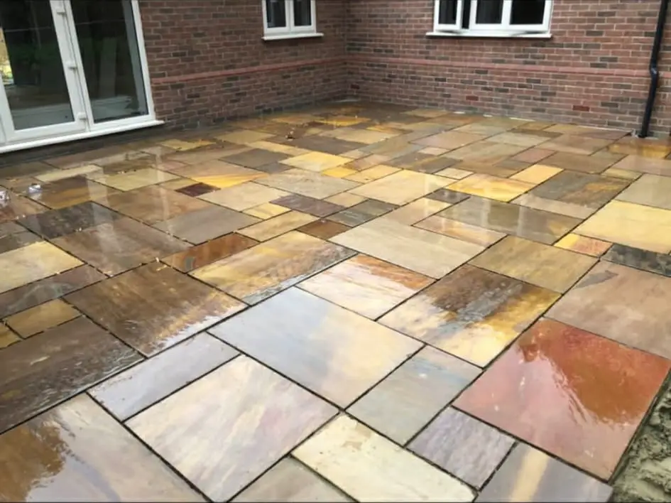 Raised porcelain patio with step detail.