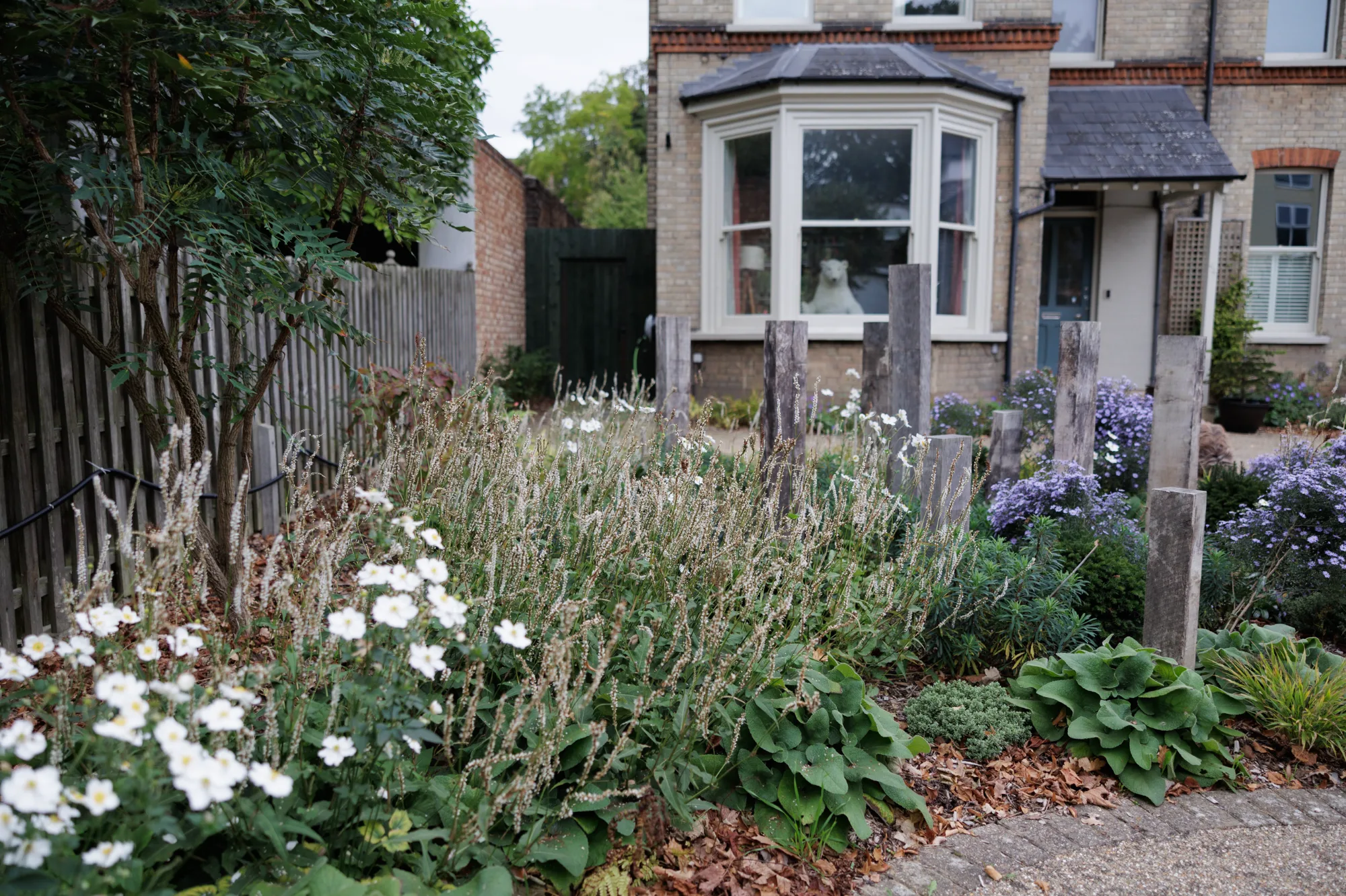Victorian front garden with naturalistic planting and reclaimed oak posts