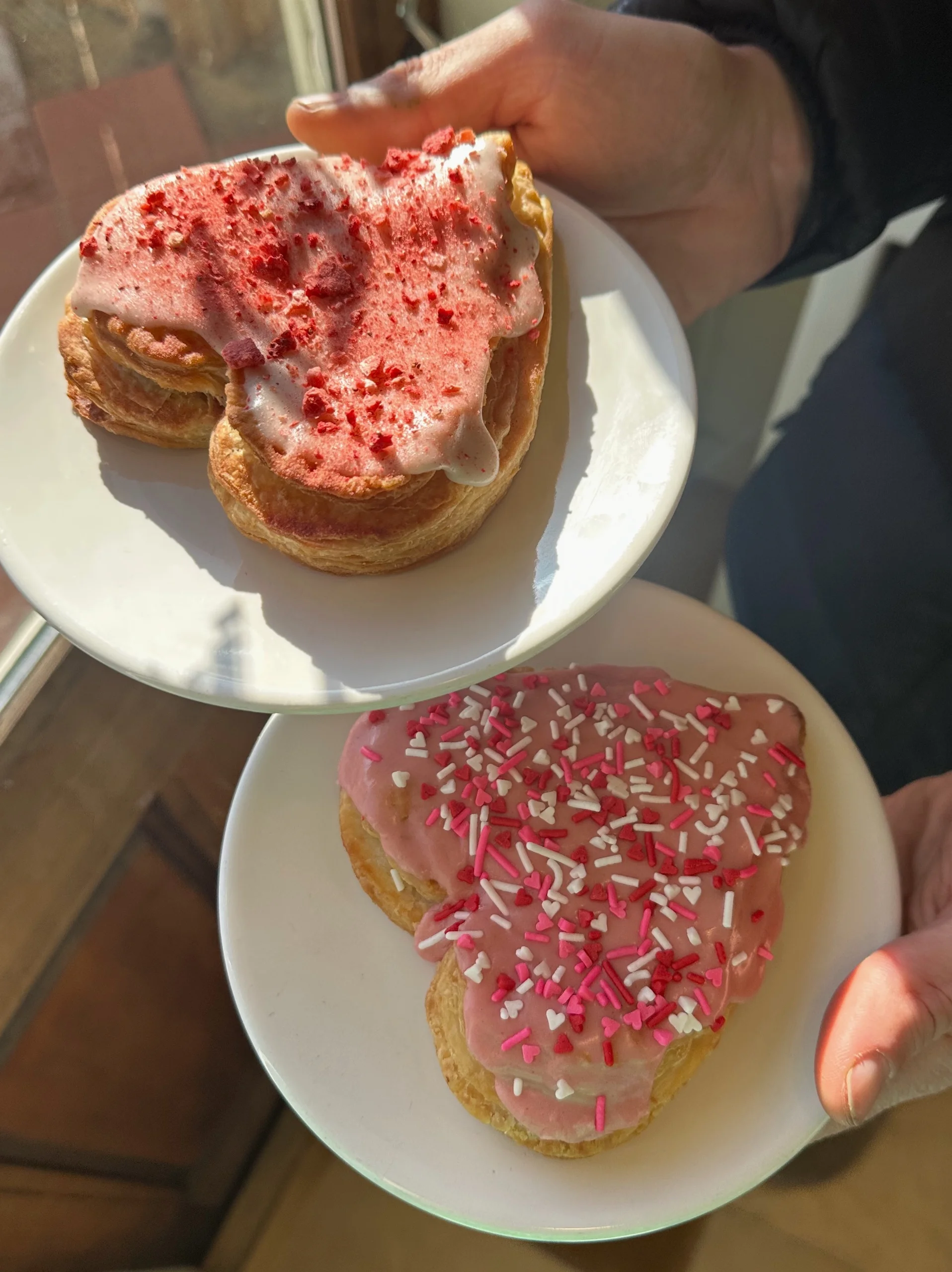 Person using a pen to cross a task off a productivity paper card.